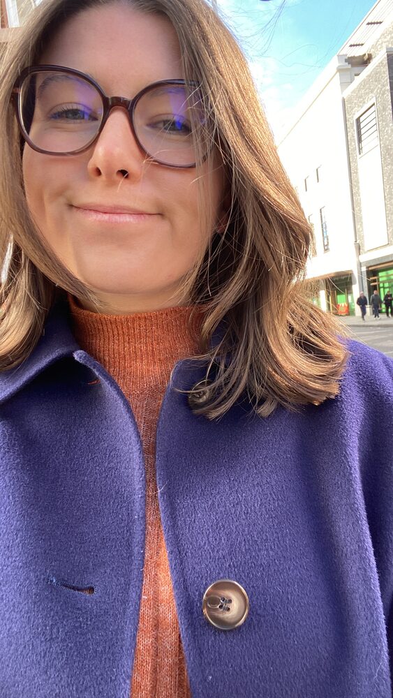 Imo Sands, certified doula in South East London, smiling outdoors